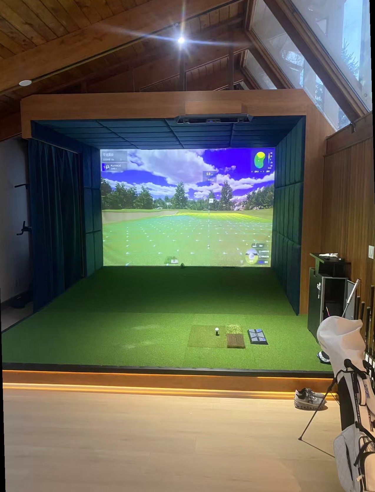 Private home golf simulator — RG Eagleye III in a sun room with vaulted ceilings